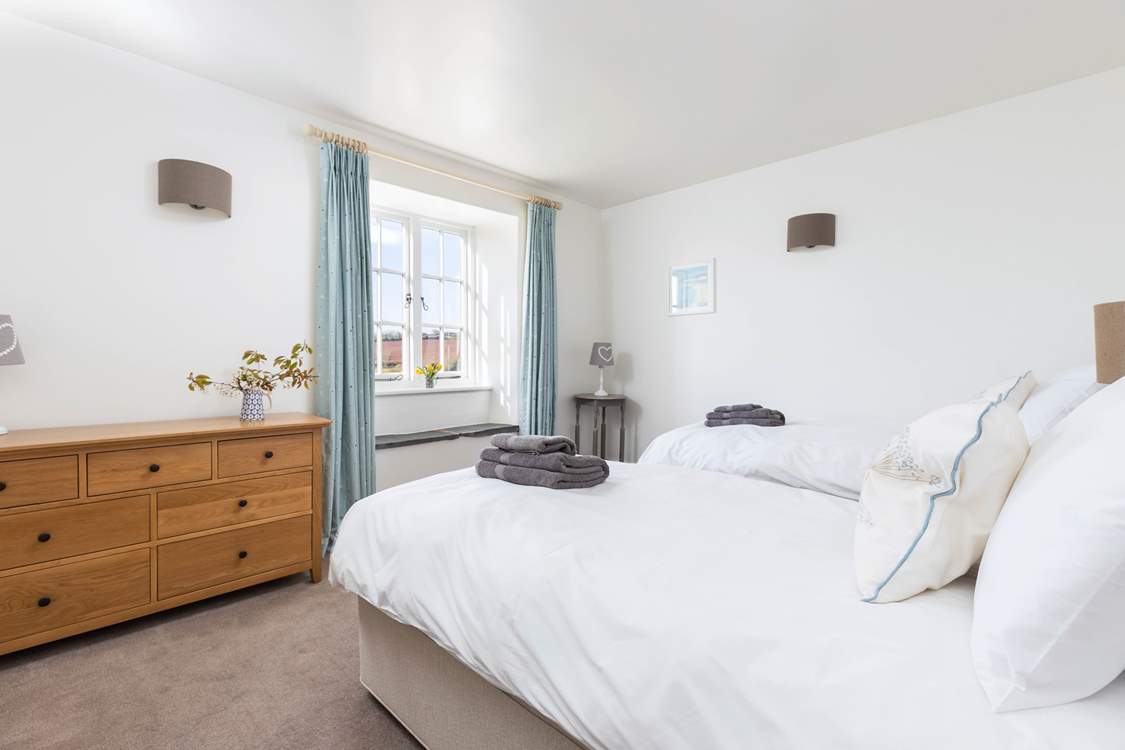 Bedroom 6 is home to these sumptuous twin beds.