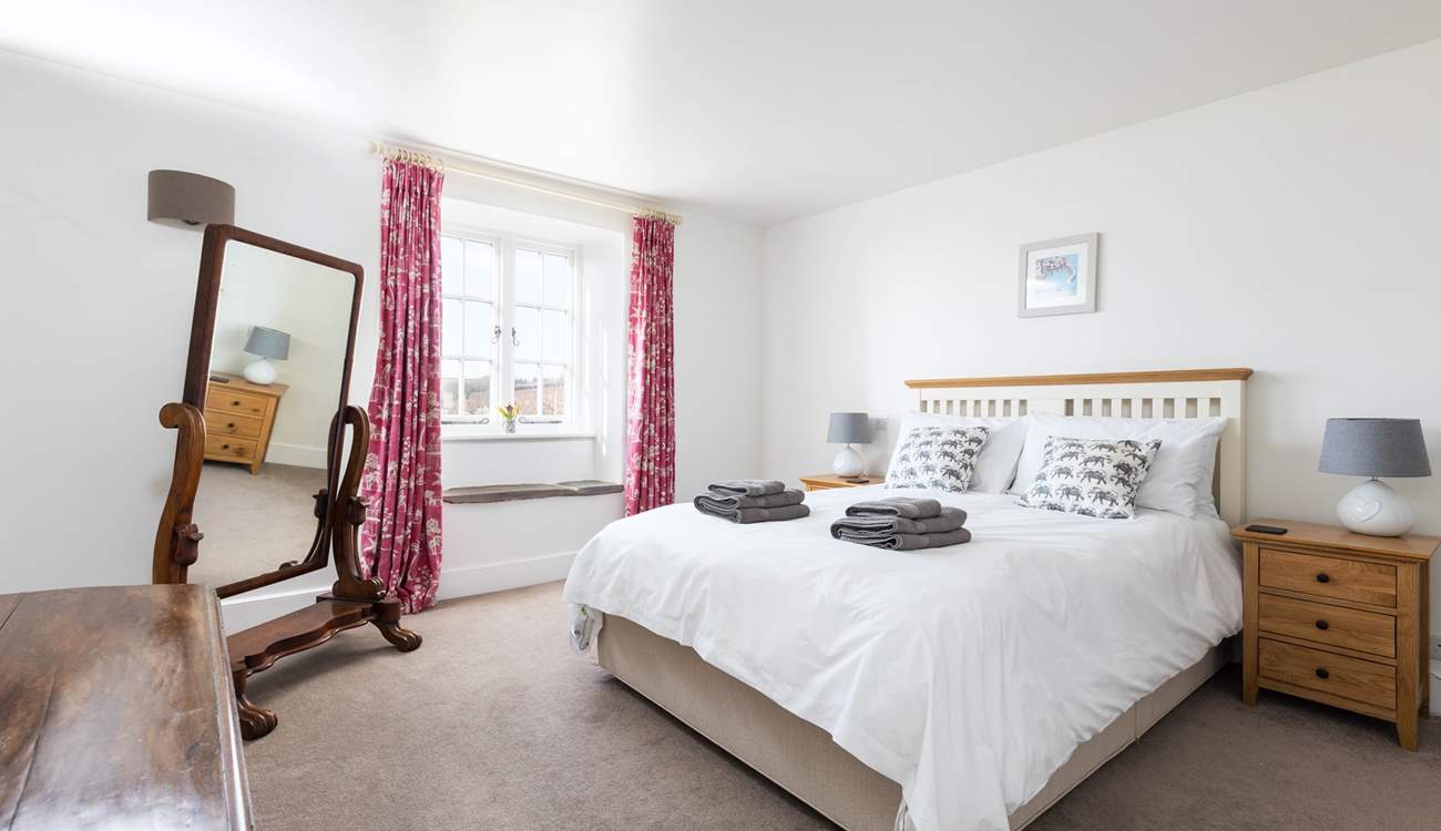 Spacious bedroom 3 is home to this comfy king-size bed.