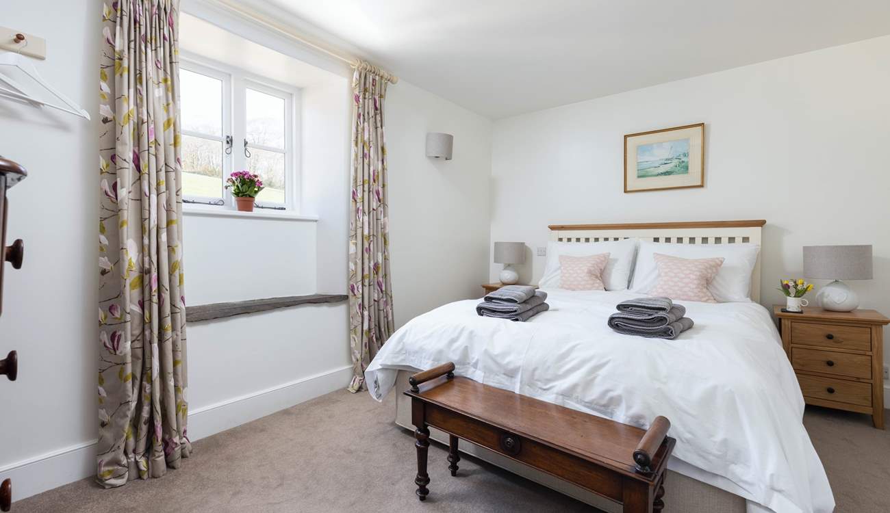 Bedroom 2 is light, airy, and super welcoming.