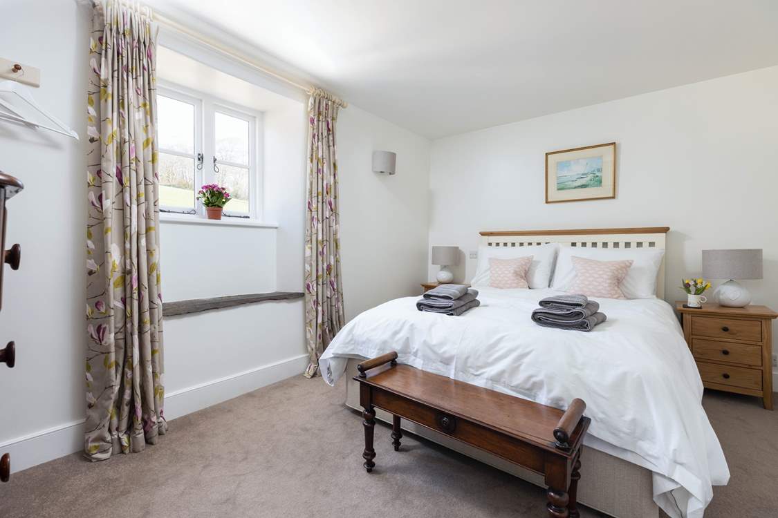 Bedroom 2 is light, airy, and super welcoming.