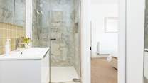 Bedroom 1 boasts this very stylish en suite shower-room.