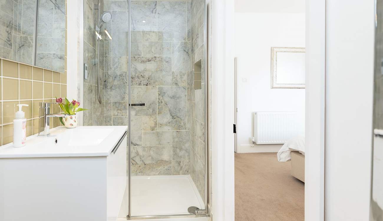 Bedroom 1 boasts this very stylish en suite shower-room.