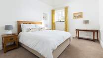 Bedroom 1 offers this king-size bed on the ground floor.