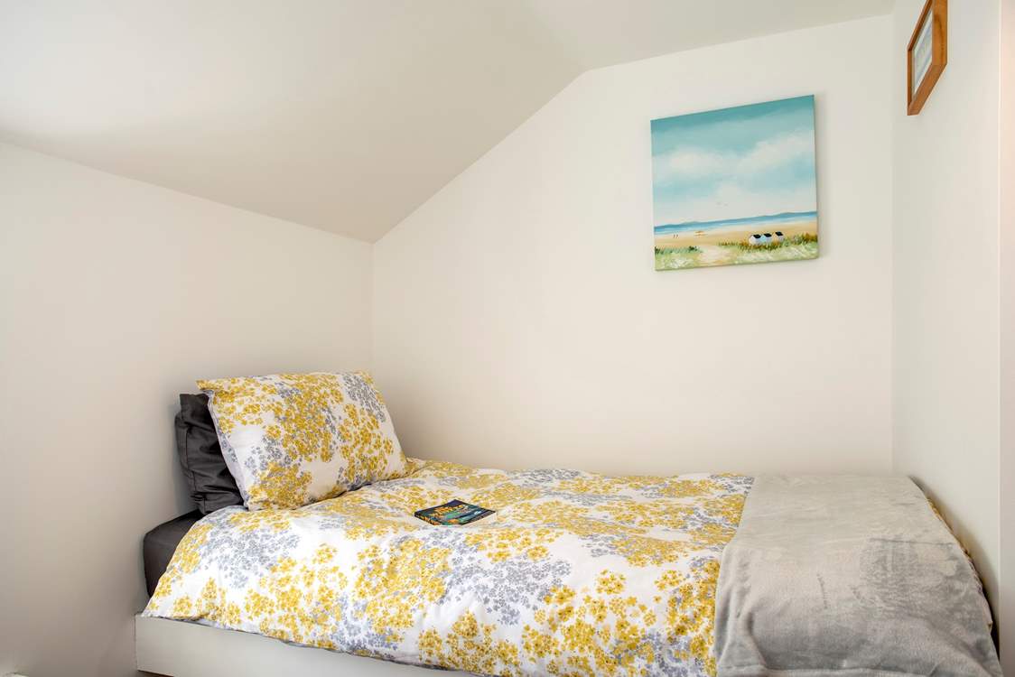 One of the beds is set a little higher but is still a full size bed.