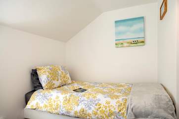 One of the beds is set a little higher but is still a full size bed.