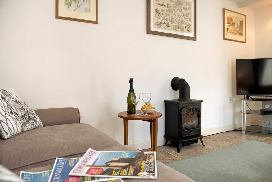 To make the room extra cosy, there's an electric wood-burner effect stove - all the romance of a wood-burning stove without the effort!