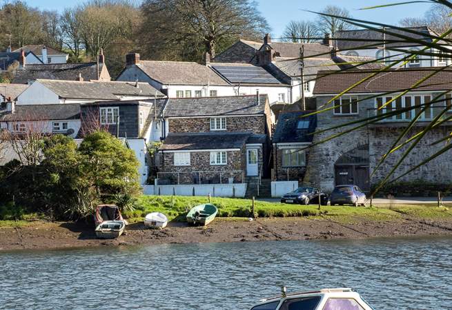 Your riverside holiday home is waiting to welcome you (Tansy is in the centre of the picture - the cottage with the white door).