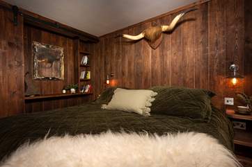 With its sheepskin throw and cow horns it's a fitting tribute to the setting.