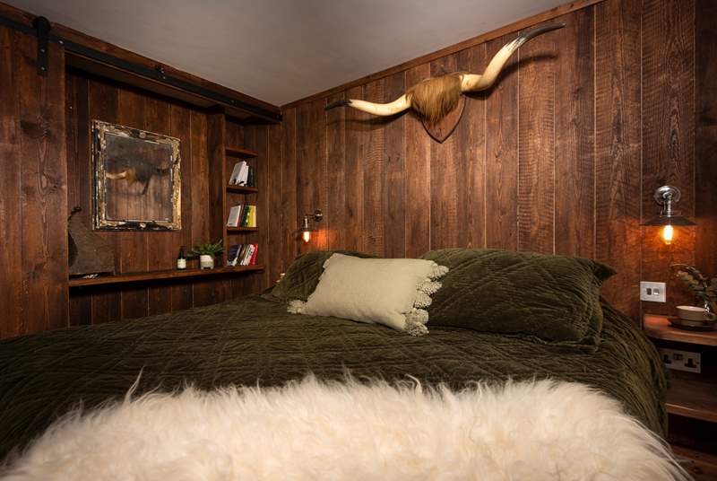 With its sheepskin throw and cow horns it's a fitting tribute to the setting.