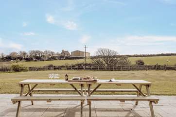 On the vast terrace there's a picnic table and chairs for a spot of al fresco dining with wonderful country views.