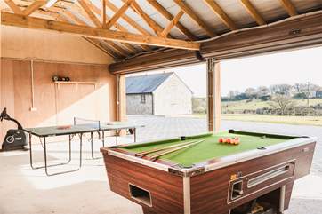 Up several steps lies the games-room (once was a double garage) which comes complete with a pool table, table-tennis, wine fridge and disco lights to keep everyone entertained.