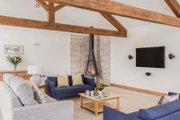 The more formal lounge to the front of the house is magnificent with a cosy wood-burner.