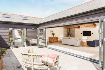 The arrival is designed to impress, and steps lead down to this gorgeous, detached property.