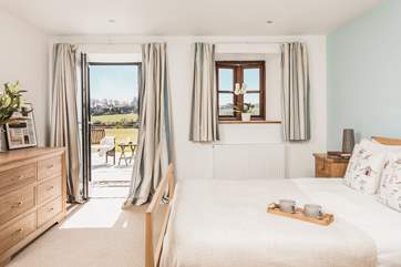 This pretty double is located on the ground floor with doors leading out onto the terrace.