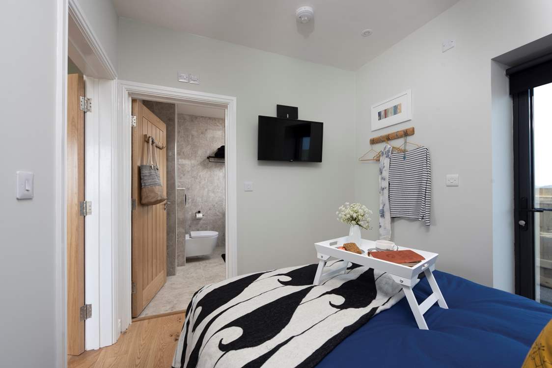 TV in bed - well you are on holiday. There are hooks for your clothes and further storage under the mattress.