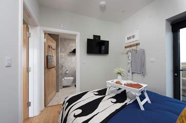 TV in bed - well you are on holiday. There are hooks for your clothes and further storage under the mattress.