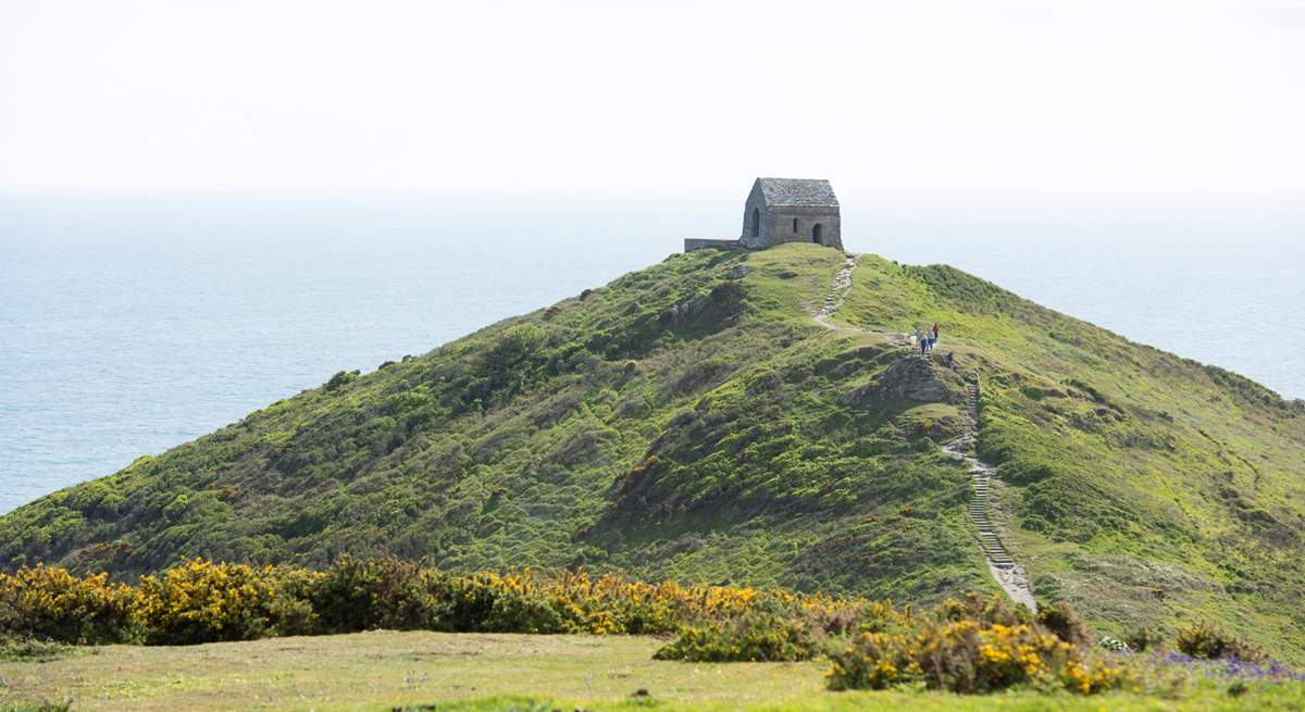 Take the footpath that leads out to the tiny chapel on the headland.