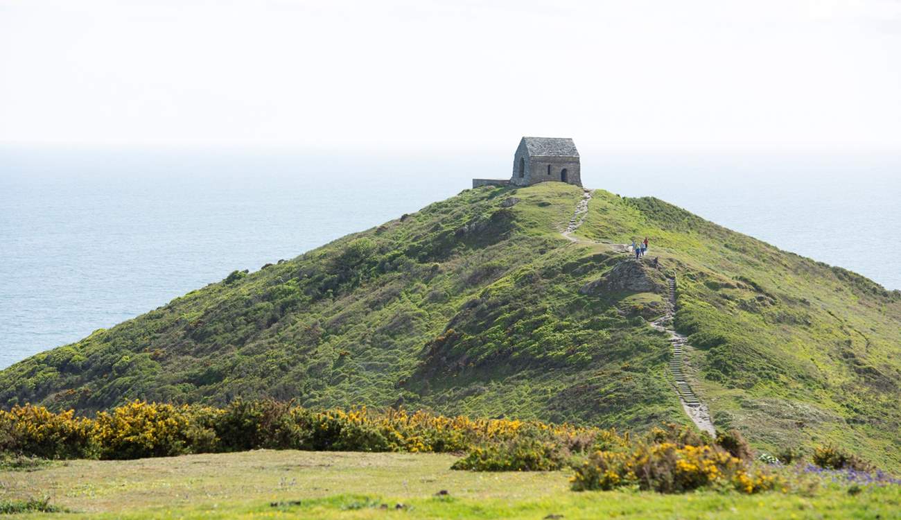 Take the footpath that leads out to the tiny chapel on the headland.