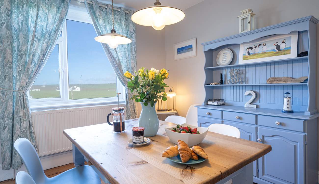 Calming blues and a tasteful seaside theme create a relaxing, peaceful vibe.