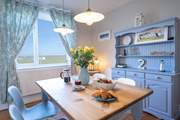 Calming blues and a tasteful seaside theme create a relaxing, peaceful vibe.