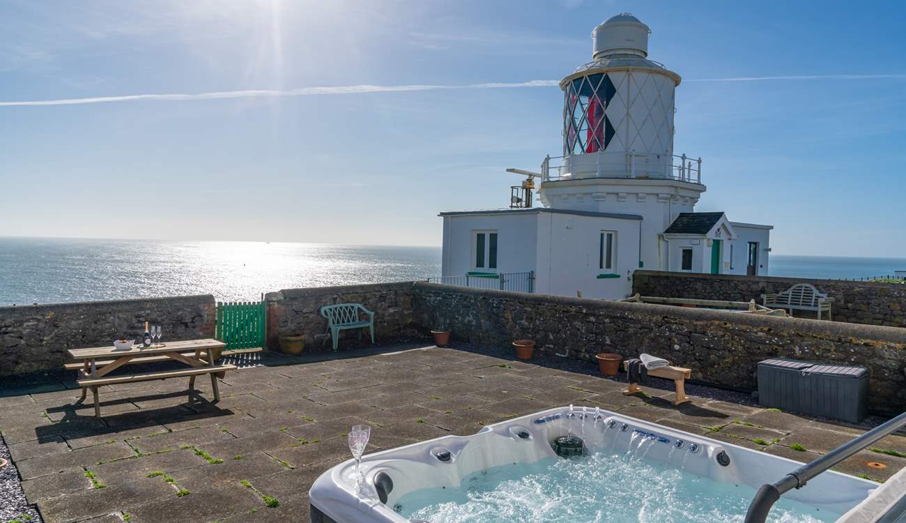 Spend blissful hours relaxing in the luxurious hot tub surrounded by the sound of the sea.
