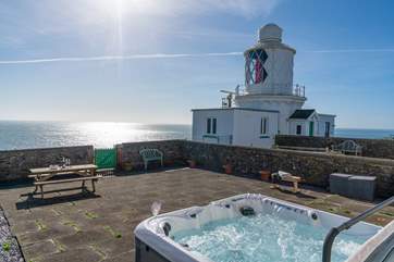 Spend blissful hours relaxing in the luxurious hot tub surrounded by the sound of the sea.