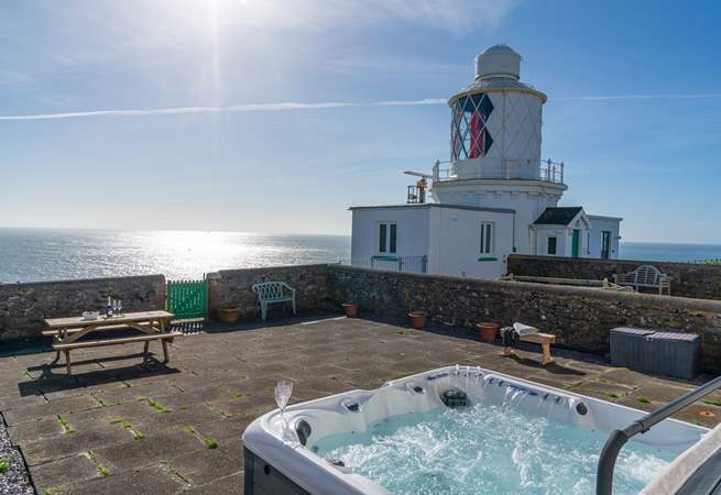 Spend blissful hours relaxing in the luxurious hot tub surrounded by the sound of the sea.