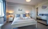 Peaceful, hushed bedroom with stylish en suite bathroom. - Thumbnail Image