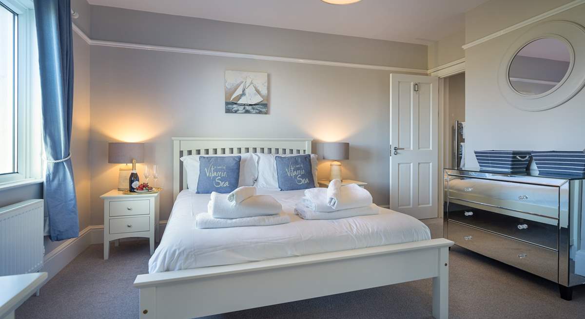 Peaceful, hushed bedroom with stylish en suite bathroom.