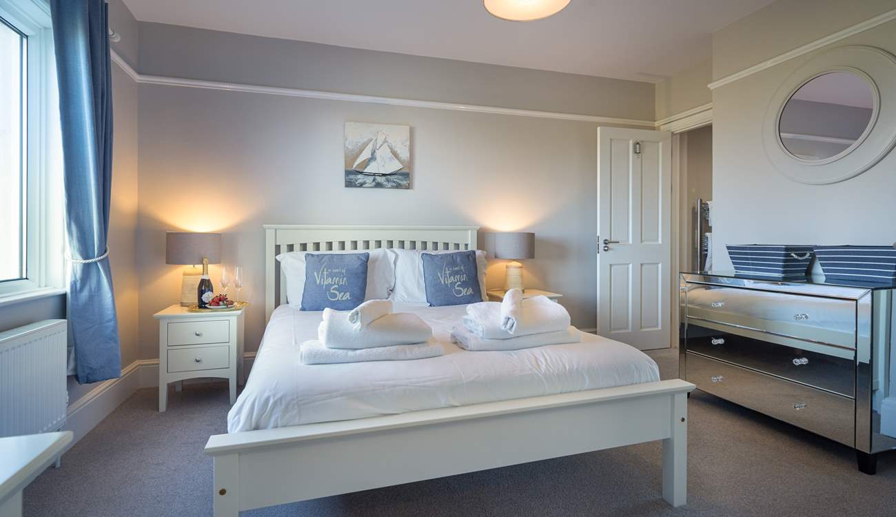 Peaceful, hushed bedroom with stylish en suite bathroom.