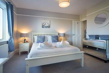 Peaceful, hushed bedroom with stylish en suite bathroom.