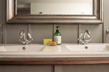 Twin sinks add to the luxury of this gorgeous apartment.