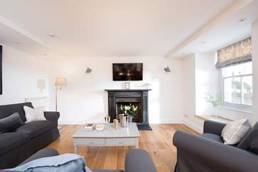 The ornamental fireplace makes a wonderful focal point in the room.