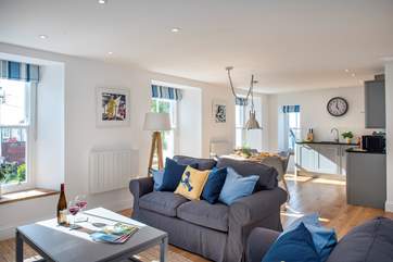 The open plan living-room is wonderfully light and airy, you'll enjoy your time together.