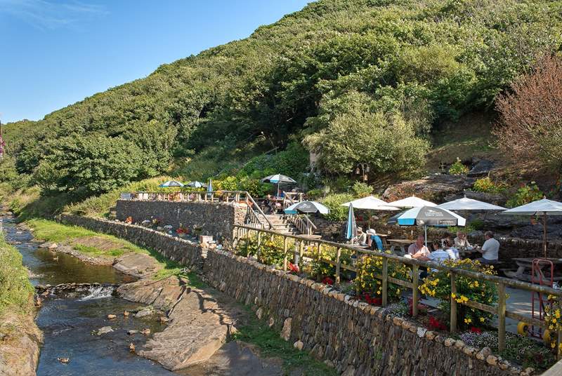 Enjoy a bite to eat alongside the river in the village.