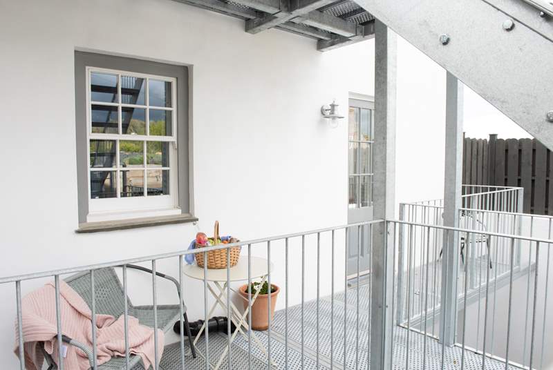There's a place to sit outside the bedroom doors, which then leads you to your own private terrace along the metal walkway.