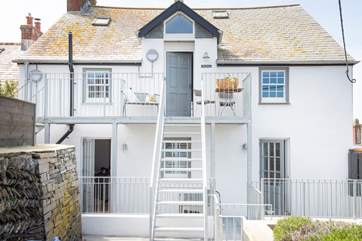 The metal steps lead down from Merchant to the sunny terrace area.