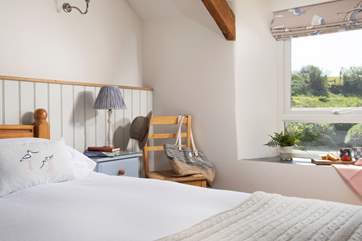 Bedroom three is dual aspect so you can enjoy sea views on one side and the countryside on the other.