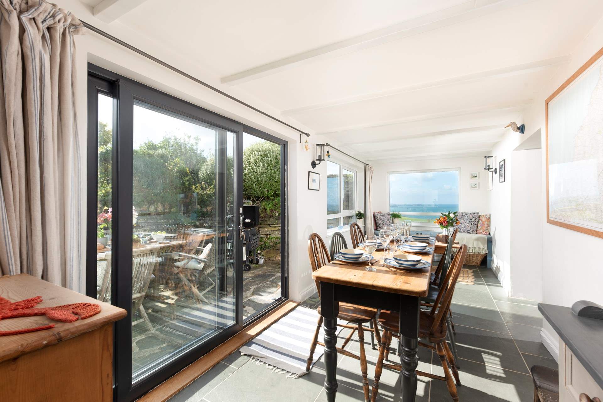Sliding doors lead out to the terrace.