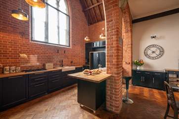 The modern style kitchen adapts well with the historic building.