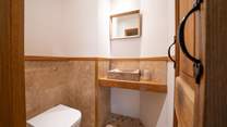 There is a WC and wash-basin on the ground floor.