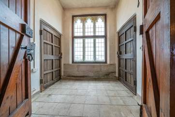 The stunning wooden double doors lead you to the front and rear of St Andrews.