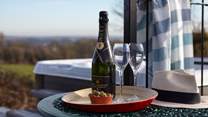 Enjoy the use of the hot tub and the fantastic views!