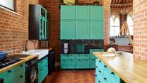 The modern style kitchen adapts well with the historic building. 