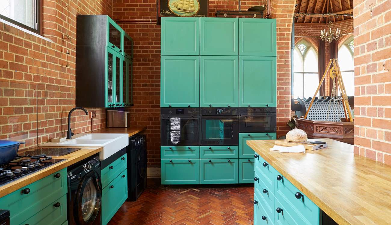 The modern style kitchen adapts well with the historic building. 