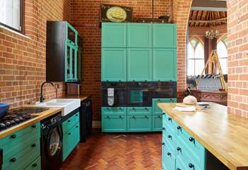 The modern style kitchen adapts well with the historic building. 