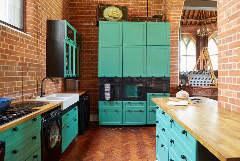 The modern style kitchen adapts well with the historic building. 