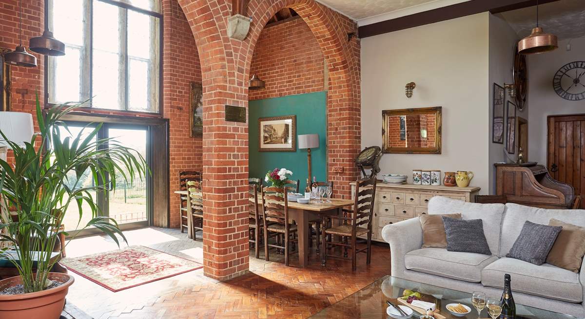 The gorgeous open plan living space with the glass patio doors leading to the garden.