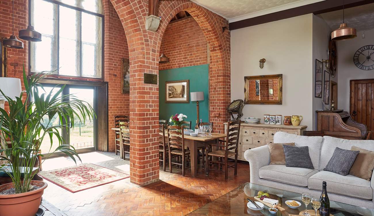The gorgeous open plan living space with the glass patio doors leading to the garden.