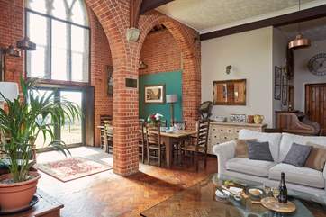The gorgeous open plan living space with the glass patio doors leading to the garden.